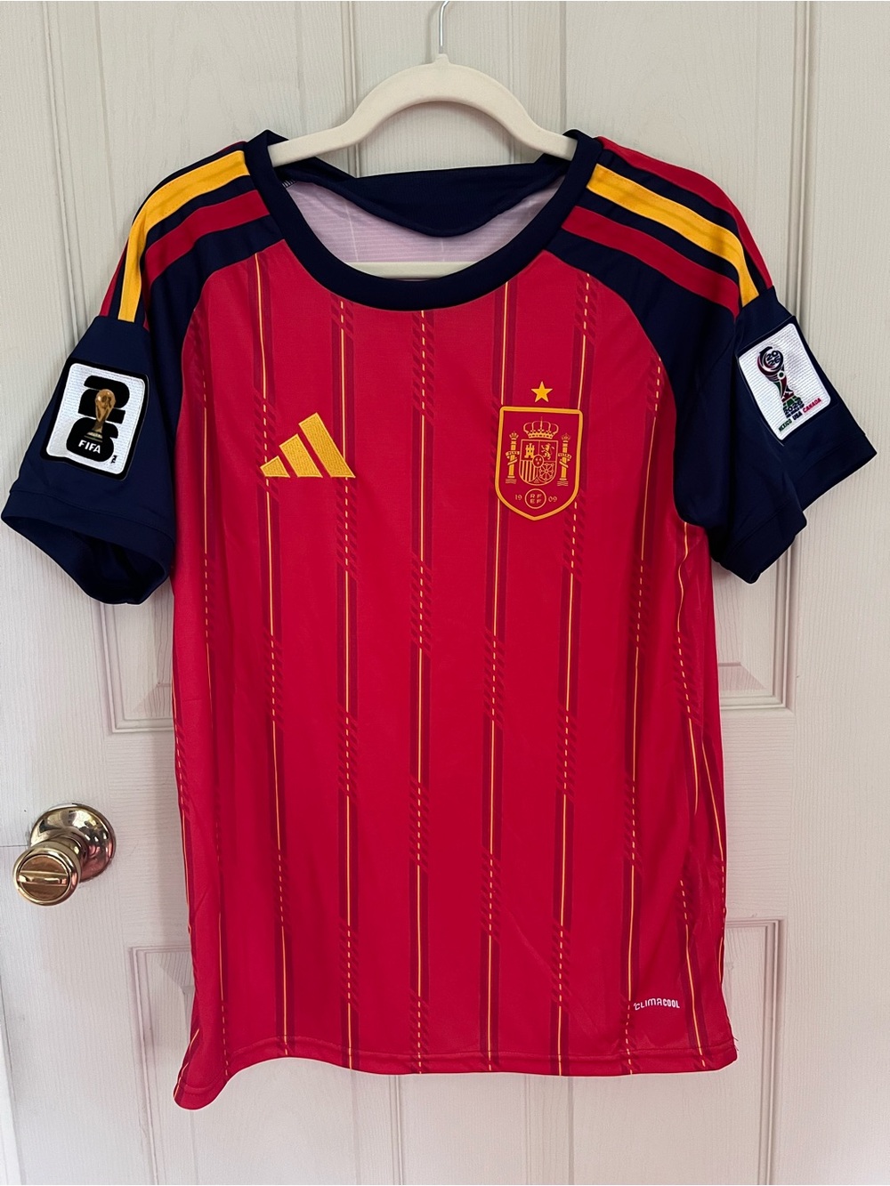 Adidas official fan inspired Spain soccer jersey with World Cup 2026 patches